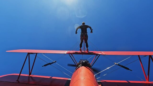 Man on airplane in flight extreme sport