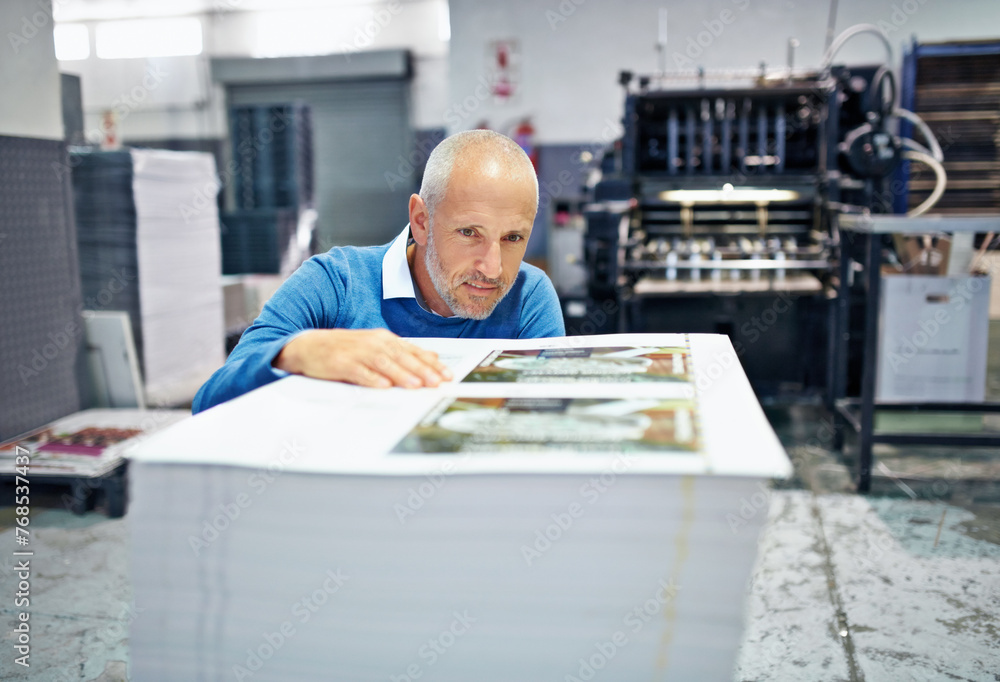 Poster printing, factory and man with paper for inspection, quality control and supply chain in workshop. w