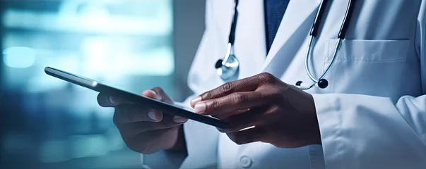 Türaufkleber Doctor using digital tablet in hospital rooms. digital healthcare and medicine review.  banner © Michal