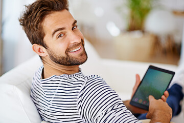 Relax, portrait or man with tablet for streaming movies or watching fun videos on a film website in home. Smile, online or happy person with technology to download on app or reading ebook on couch