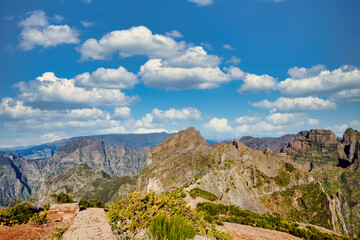 The picturesque stone trail PR 1 in Madeira. The route leads through rocky terrain, surrounded by...