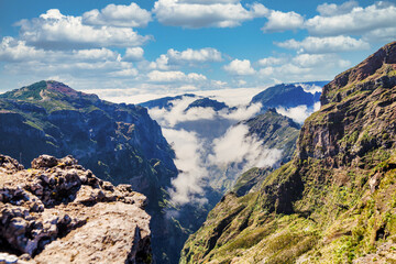 The picturesque stone trail PR 1 in Madeira. The route leads through rocky terrain, surrounded by...