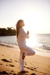 Meditation, prayer and balance with woman on beach at sunset, mindfulness and zen with fresh air...