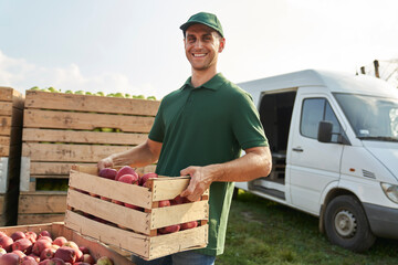 Portrait of sales representative on apple orchard