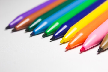 close up set of colorful drawing markers on white background