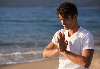 Meditation, hands with prayer and man on beach, mindfulness and zen with fresh air for calm...