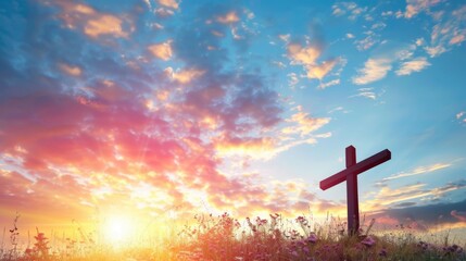 Wooden cross in a field at sunset with dramatic sky. - obrazy, fototapety, plakaty