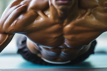 Foto op Plexiglas closeup of a toned torso during a plank exercise © studioworkstock