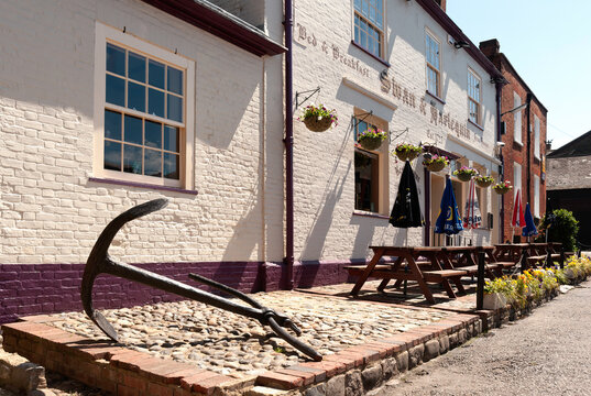FAVERSHAM, KENT, UK - JUNE 26, 2011:   Exterior view of the Swan and Harlequin pub in Conduit Street with sign