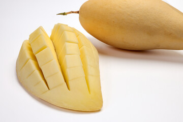 Yellow mango tropical fruit whole sliced cube diced half on white background - 768576442