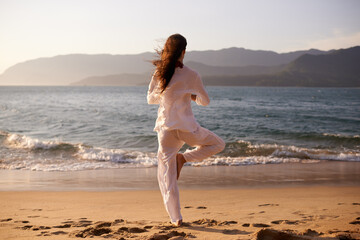 Beach, meditation or woman in nature at sunset for peace, zen or mental health wellness. Spiritual,...