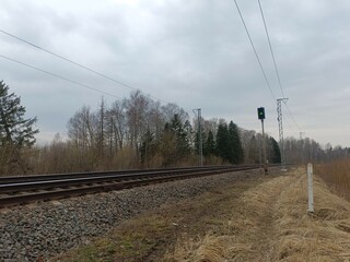 Two way railroad tracks in countryside. Two railway tracks. Cloudy day. Countryside. Fields and...