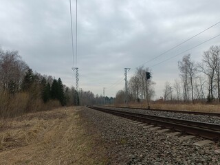 Two way railroad tracks in countryside. Two railway tracks. Cloudy day. Countryside. Fields and...