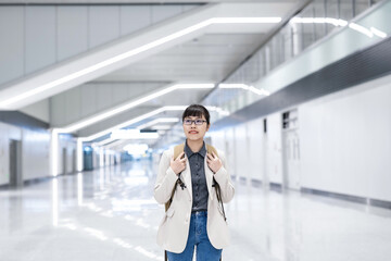 Woman walking commuting in subway station