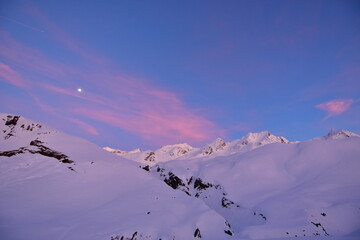 Dusk in swiss alps vermigel hut near Andermatt winter snow moon