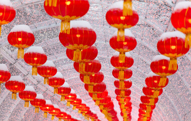Red lanterns in the snow in the park. Chinese New Year holiday - 768591819