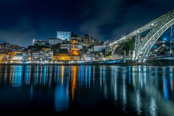 Night skyline of Porto, Portugal, on the banks of the Douro River, cityscape at night.