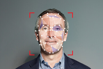 Facial recognition of senior businessman. Mature man with technology biometric security system - 768594415