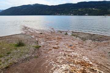 Muddy stormwater stream in Millstatter See, Austria. Landscape of Austria.