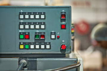 Factory, production and technology of machine closeup on system at manufacturing warehouse. Industrial, process and press button or click control panel dashboard to start productivity or development