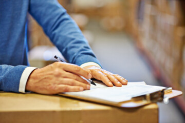 Hand, writing and inspector with closeup of clipboard in warehouse for inventory, quality control...