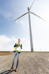Confident Engineer Overseeing Renewable Energy Project at Wind Farm - 768598859