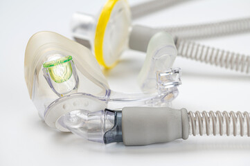 Respiratory mask for sleep disorders isolated over white. Apnea. Air pump. Assisted breathing.