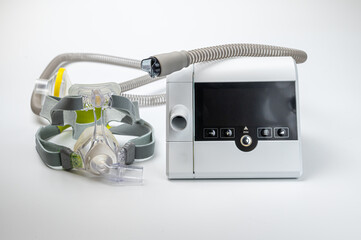 CPAP machine with mask and hose, for people with sleep apnea, respiratory, or breathing disorder