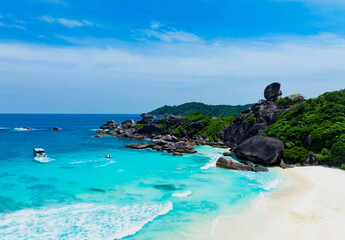 The white sand beach tropical with seashore as the island in a coral reef ,blue and turquoise sea...