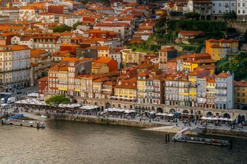 Fototapeta na wymiar Old city of Porto, during sunset. Portugal's old town from the Dom Luis I bridge on the Douro river.