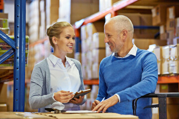 Teamwork, collaboration and employees at warehouse for logistics, inventory and discussion in...