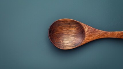Wooden spoon from a top angle, with the background removed for easy use in design projects.