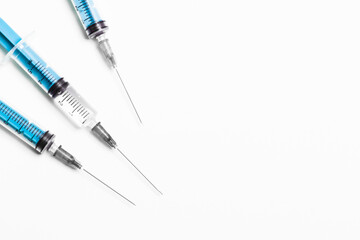 Fototapeta premium Disposable plastic syringe prepared for injection and vaccination in the hospital. The concept of medicine and health