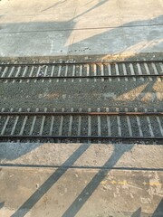 A railway track or railroad track, also known as a train track or permanent way, is the structure on a railway or railroad consisting of the rails, fasteners, railroad ties and ballast, plus the under
