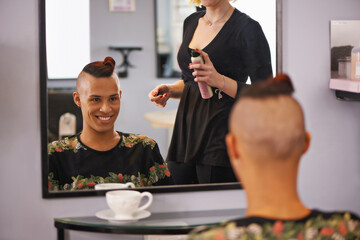 Spray, styling and happy man in mirror with hairdresser for professional haircare, cut or luxury...