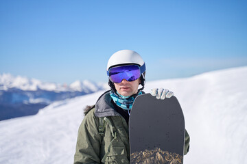 Fototapeta na wymiar Snowboarder with a Mountain Backdrop