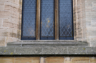 Close Up of Leaded Windows in Old Stone Church 
