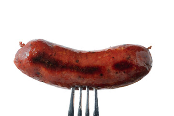 Grilled smoked beef sausage on a fork isolated on white background
