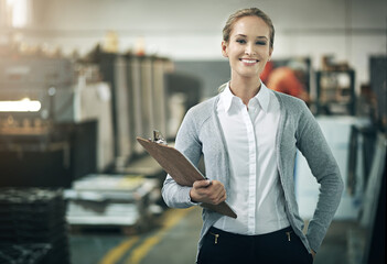 Woman, manufacturer and happy at factory or warehouse with clipboard for paperwork and...