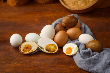 Various salted eggs on retro background