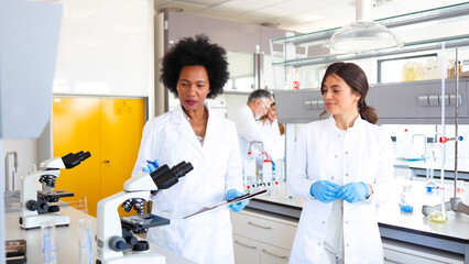 African American female scientist leading some research in the lab