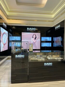 Rado wrist watch in brand store in shopping mall. Famous luxury trademark. Swiss watchmaker. Latest modern models in glass showcase. Official shop. Authorized reseller. Retailer. Swatch Group.