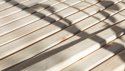 Wooden beams in a row on a sunny day. Construction and repair. Close-up. Space for text. Background.