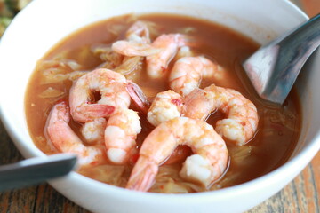 Selective focus of shrimp curry. Thai shrimp curry in white bowl