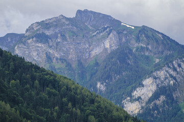 Stunning scenic view of snow mountain peaks of Alps in Switzerland. Beautiful Alps Mountain landscape, telephoto shot.