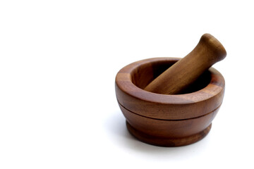 Wooden mortar and pestle on white background