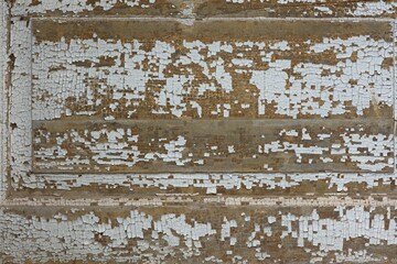 Closeup of old wood wall with white paint cracked for backgrounds.