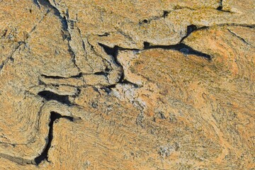 Closeup of seamless rock texture with cracks for backgrounds.
