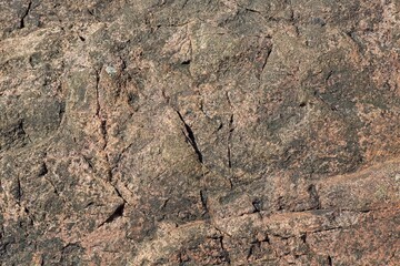 Closeup of seamless rock texture with cracks for backgrounds.