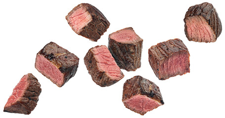 Medium rare steak pieces, sliced grilled beef cubes isolated on white background